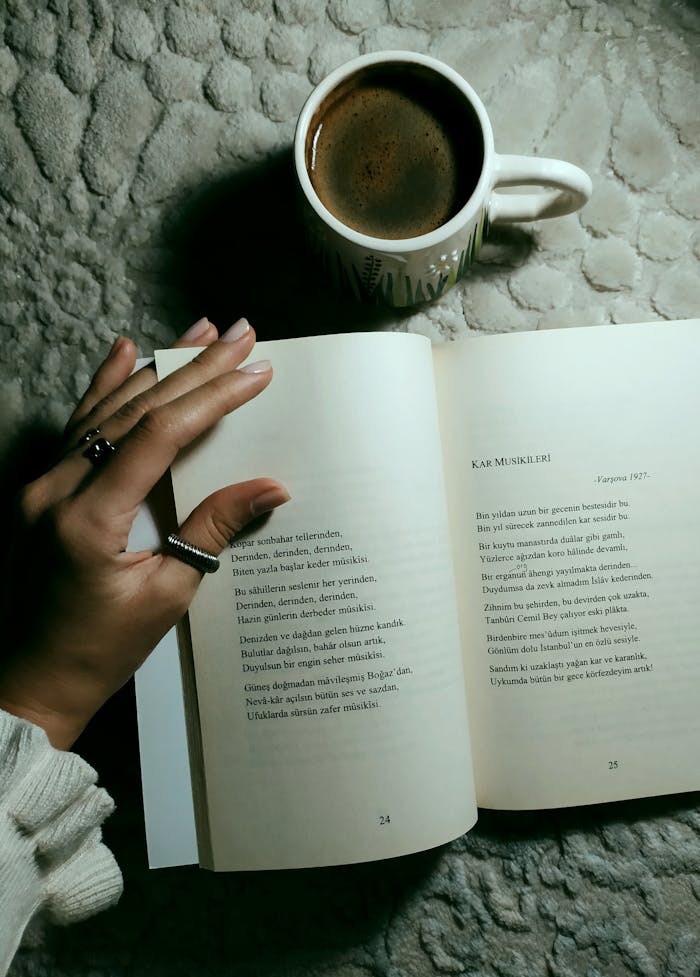 A cozy moment featuring a warm coffee and an open book of poetry, enhancing a peaceful ambiance.